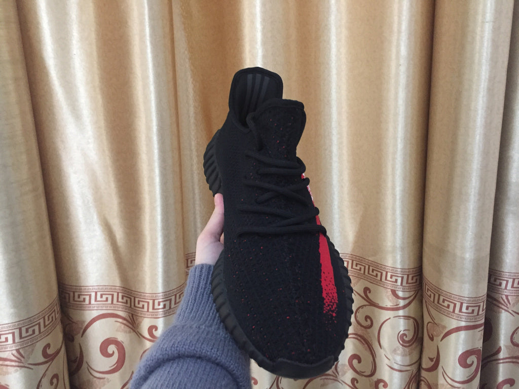 Yeezy 350 V2 Sneakers in Black and Red Knit - product image from the listing.