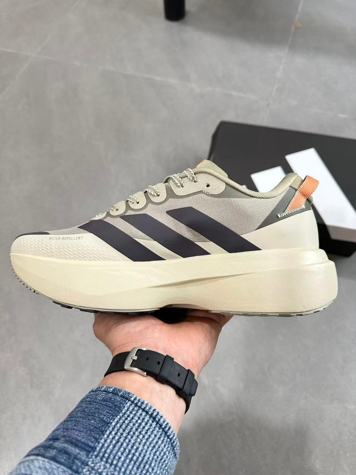 Adidas Adizero Lightstrike Pro Running Shoes, in Cream and Navy - product image from the listing.