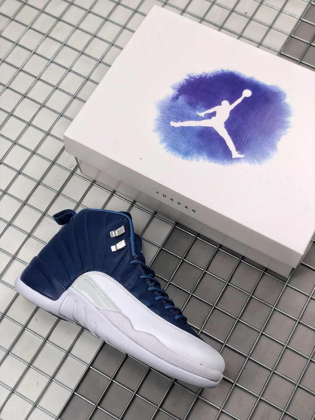 Air Jordan 12 Indigo Sneakers 130690-404 - product image from the listing.
