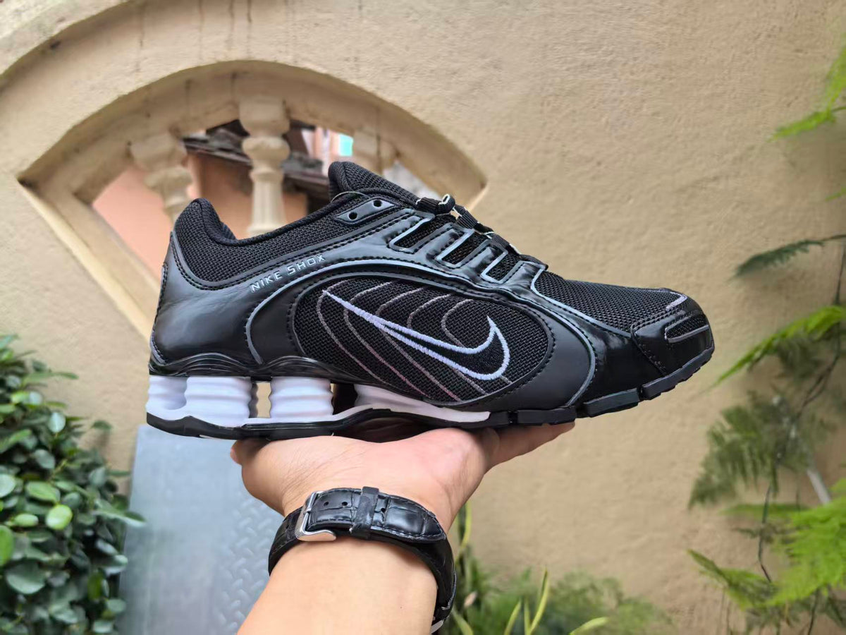 Nike Shox R4 Sneakers in Black and White - product image from the listing.
