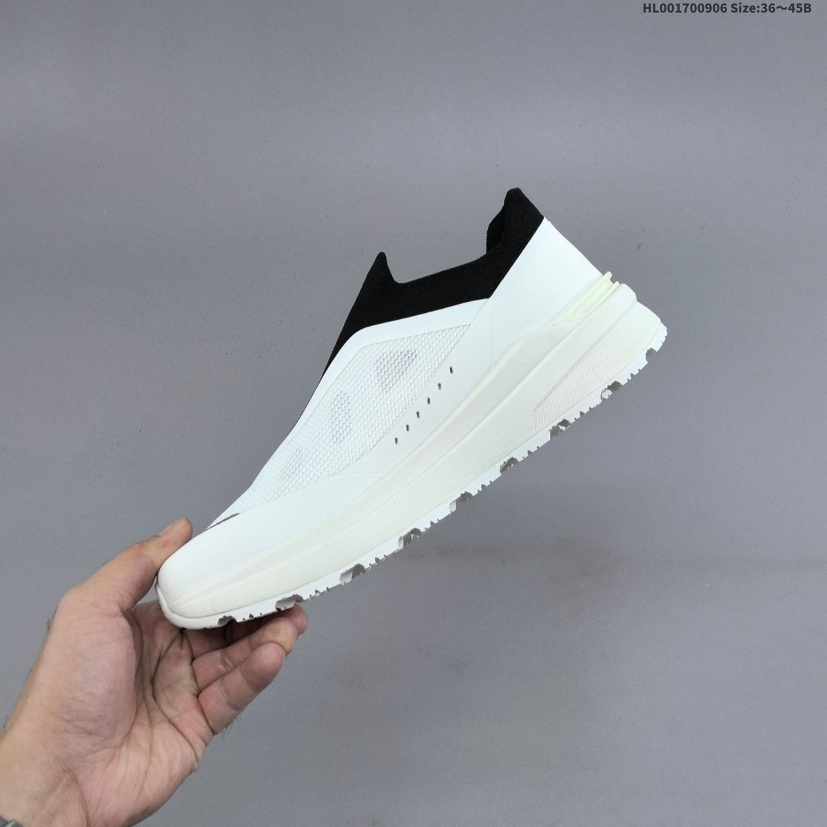 Descente Dualis Primer Slip-On Sneakers, in White and Black - product image from the listing.