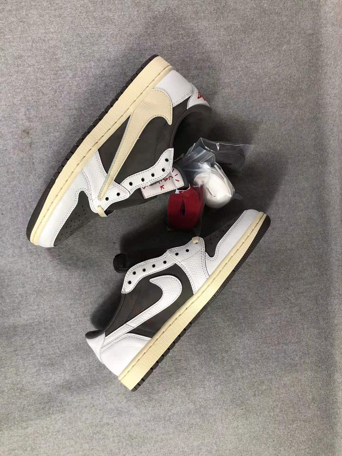 Travis Scott x Air Jordan 1 Low Sneakers in White Brown - product image from the listing.