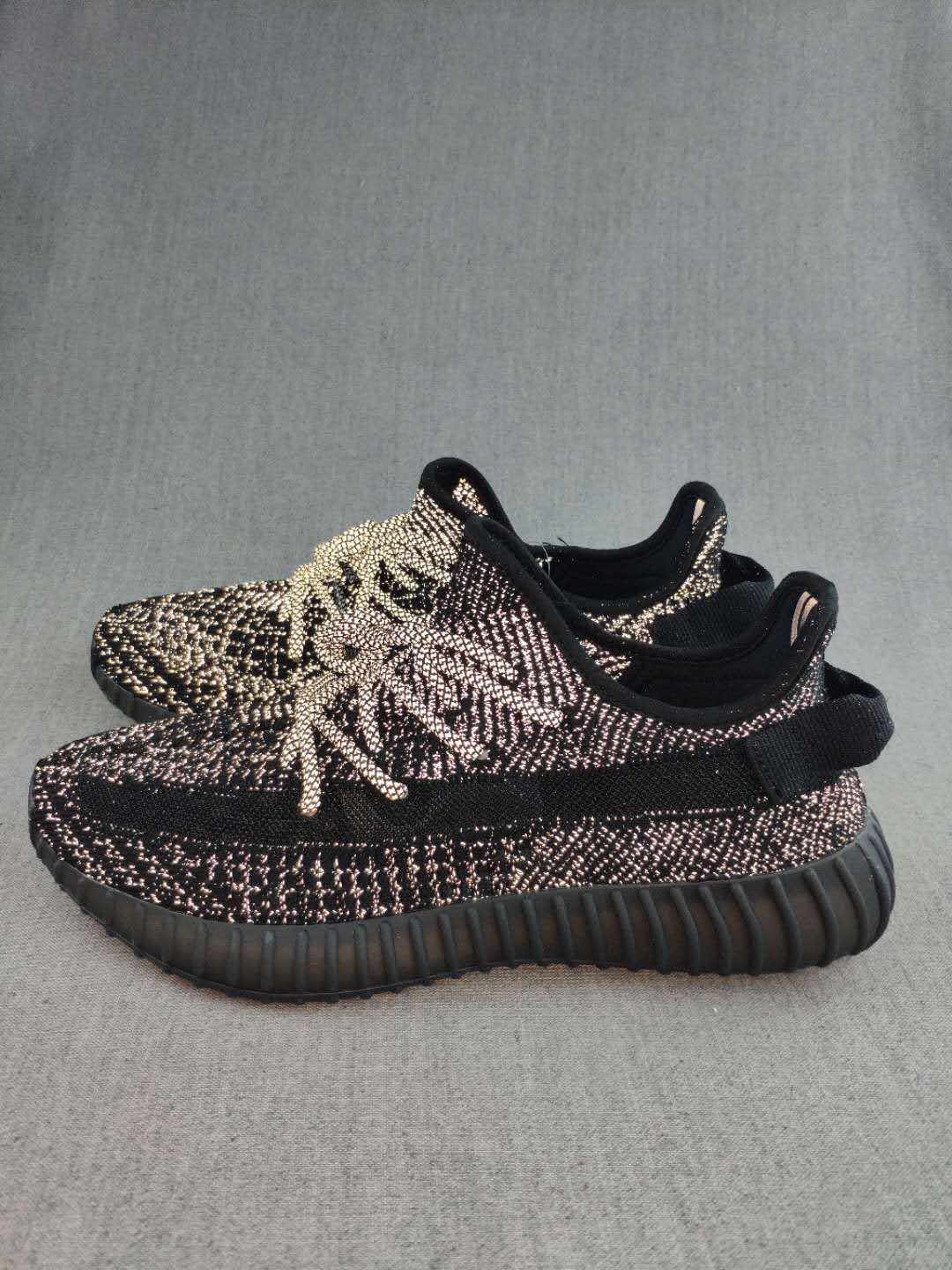 Black and Cream Yeezy 350 V2 Knit Sneakers - product image from the listing.