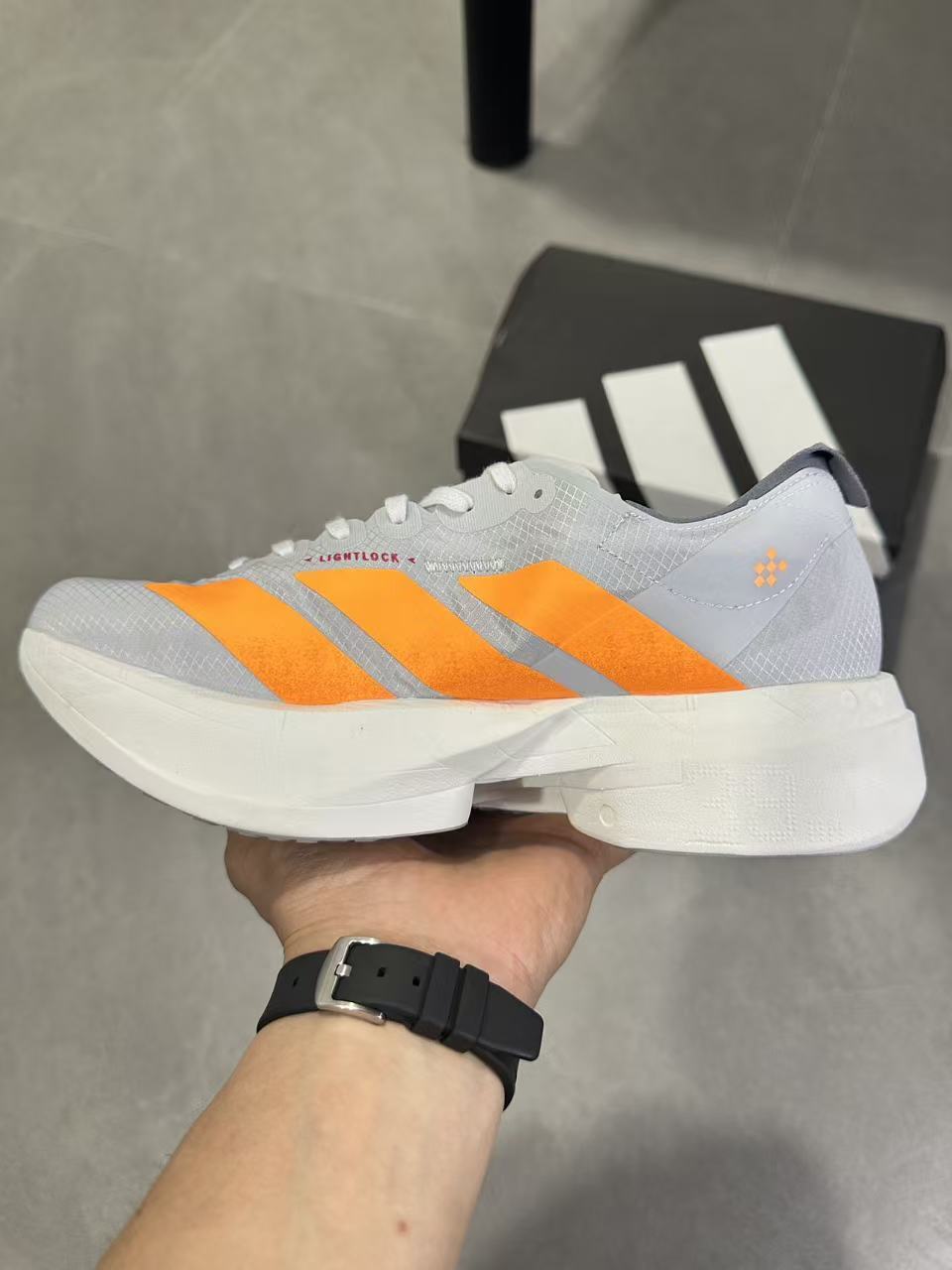 Adidas Adizero Lightstrike Pro Running Shoes in White Orange - product image from the listing.