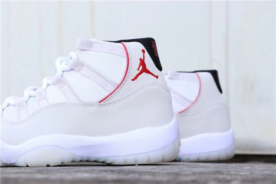 Air Jordan 11 Platinum Tint White High-Top Sneakers - product image from the listing.