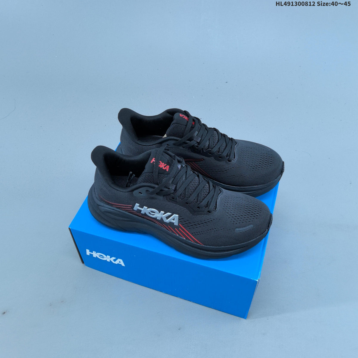 HOKA Clifton 11 Black Shoes for Running with Red Accents - product image from the listing.