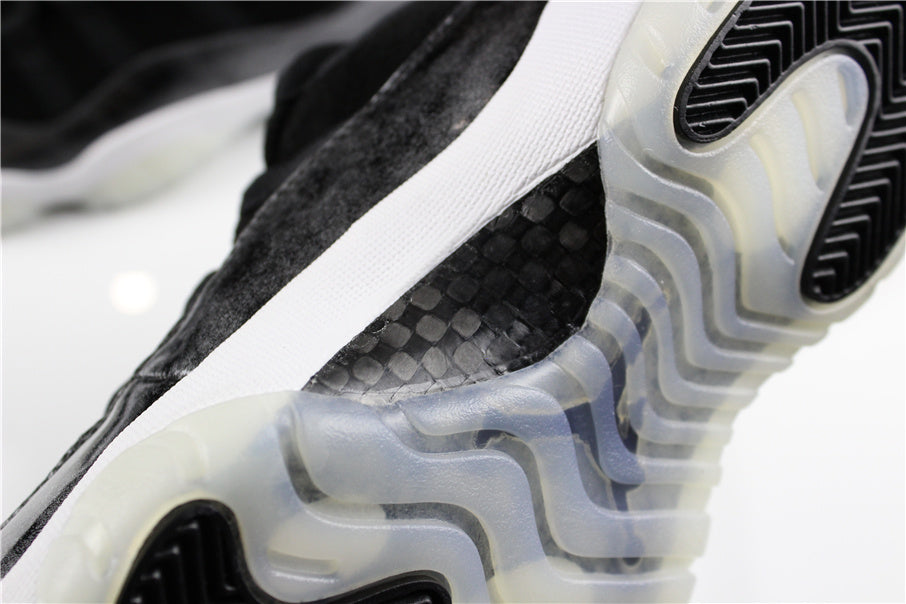 Jordan 11 Retro Low Barons Sneakers in Black White - product image from the listing.
