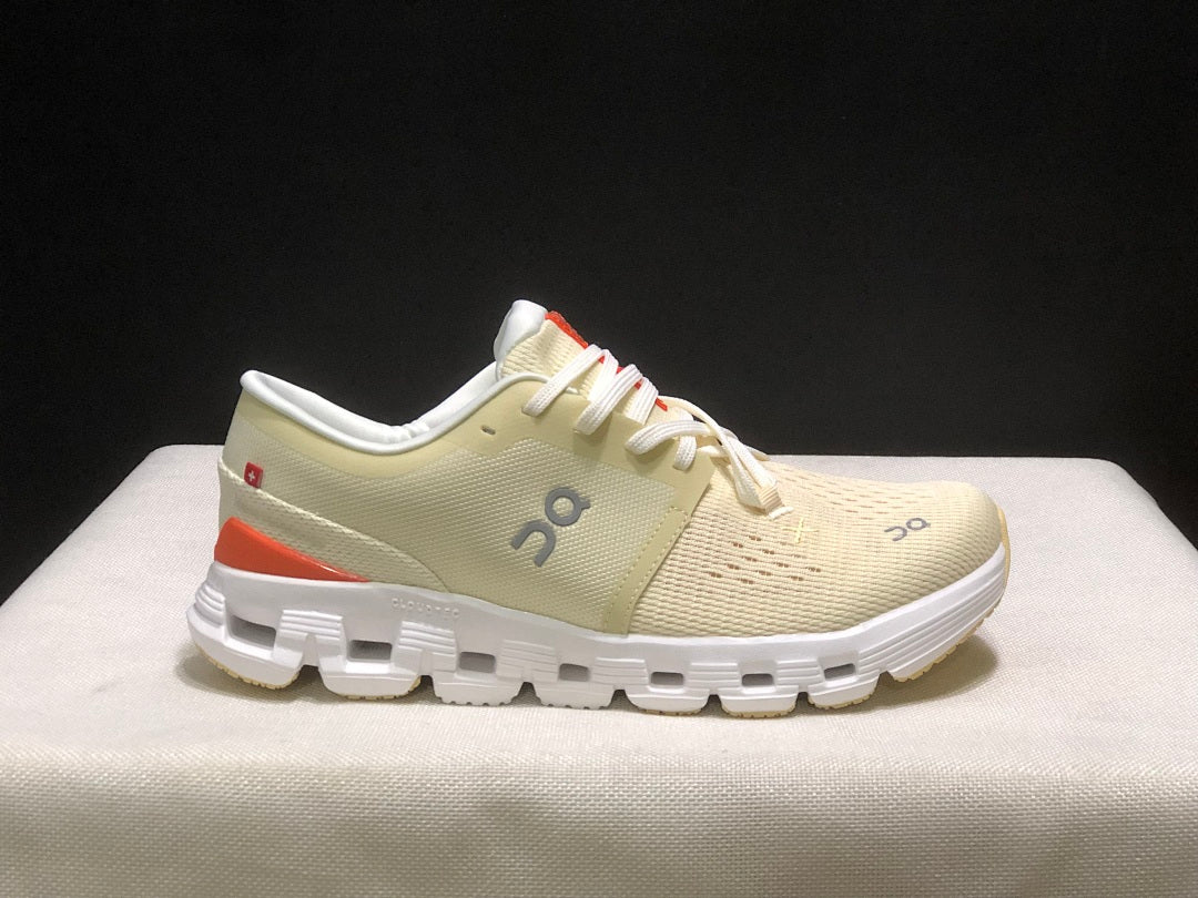 Cream and Orange On Cloud X 4 Sneakers - product image from the listing.