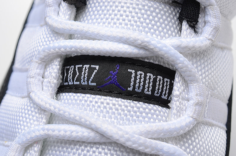 Air Jordan 11 Low Basketball Sneakers in White Black - product image from the listing.