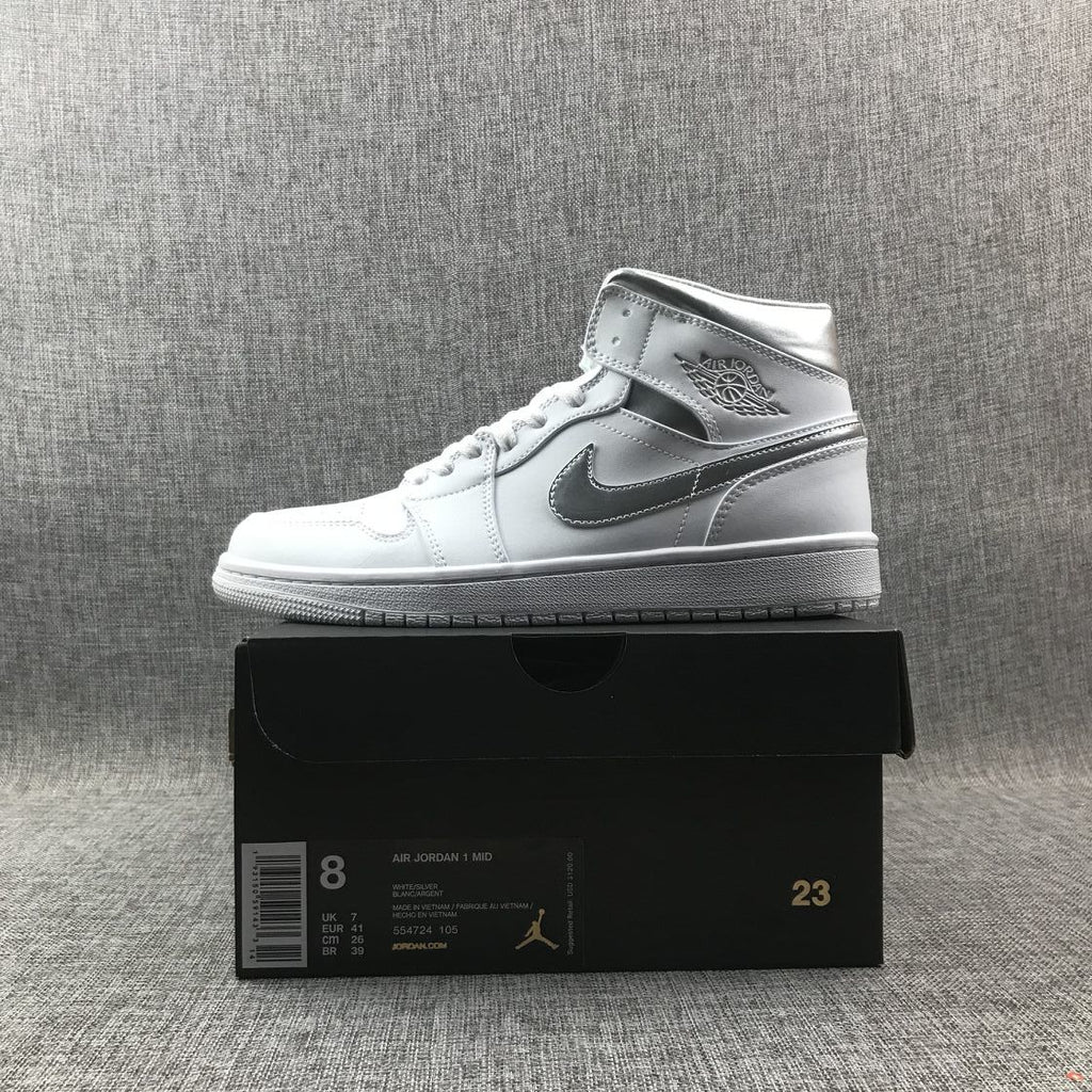Air Jordan 1 Mid Sneakers in White Silver 554724-105 - product image from the listing.