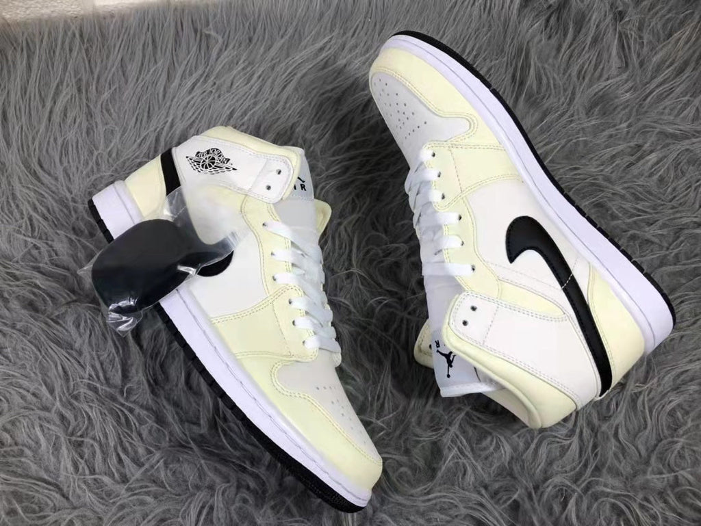 Jordan Air 1 Mid Sneakers in Cream White and Black - product image from the listing.