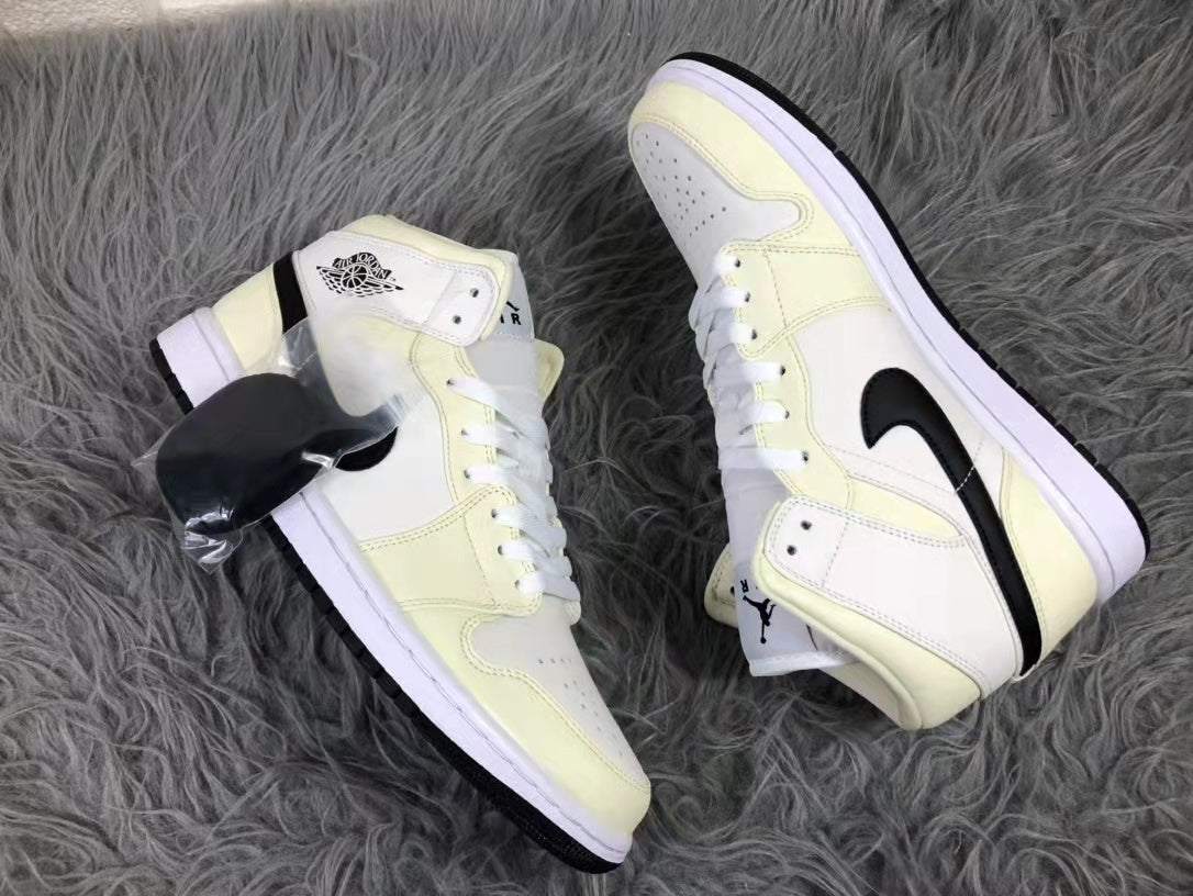Jordan Air 1 Mid Sneakers in Cream White and Black - product image from the listing.
