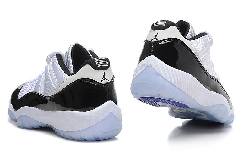 Air Jordan 11 Low Basketball Sneakers in White Black - product image from the listing.