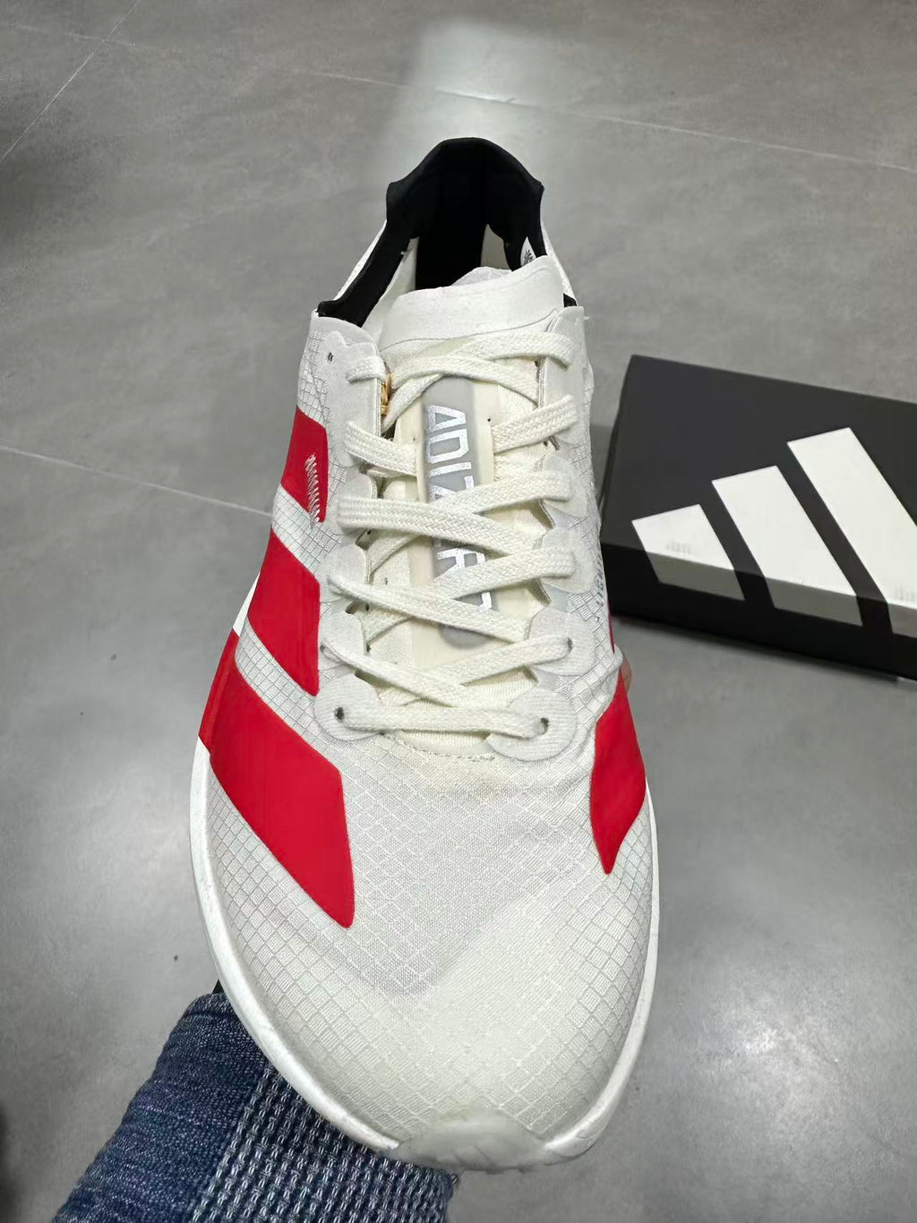 Nike Lightstrike Pro Running Sneakers in White and Red JR6363 - product image from the listing.