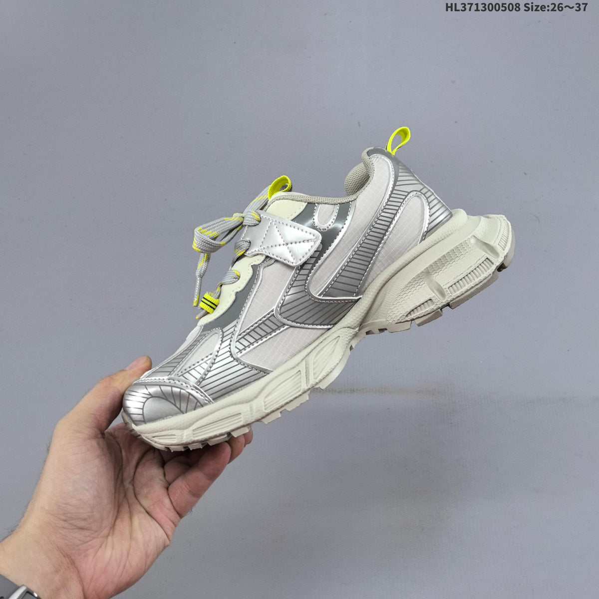 Balenciaga Kids Chunky Lace-Up Sneakers, in Silver and Charcoal - product image from the listing.