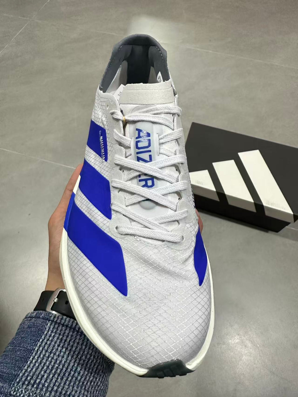 adidas Lightstrike Pro Running Shoes in White Blue - product image from the listing.