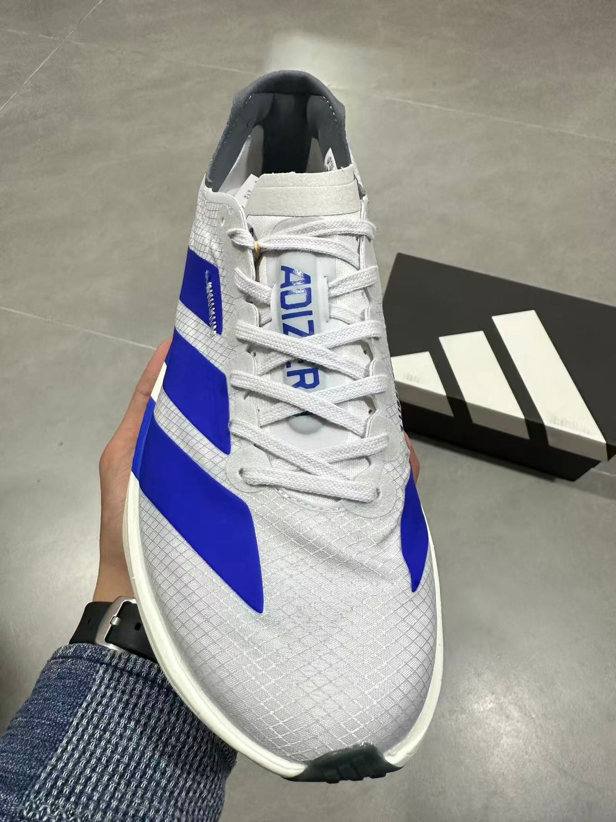 adidas Lightstrike Pro Running Shoes in White Blue - product image from the listing.