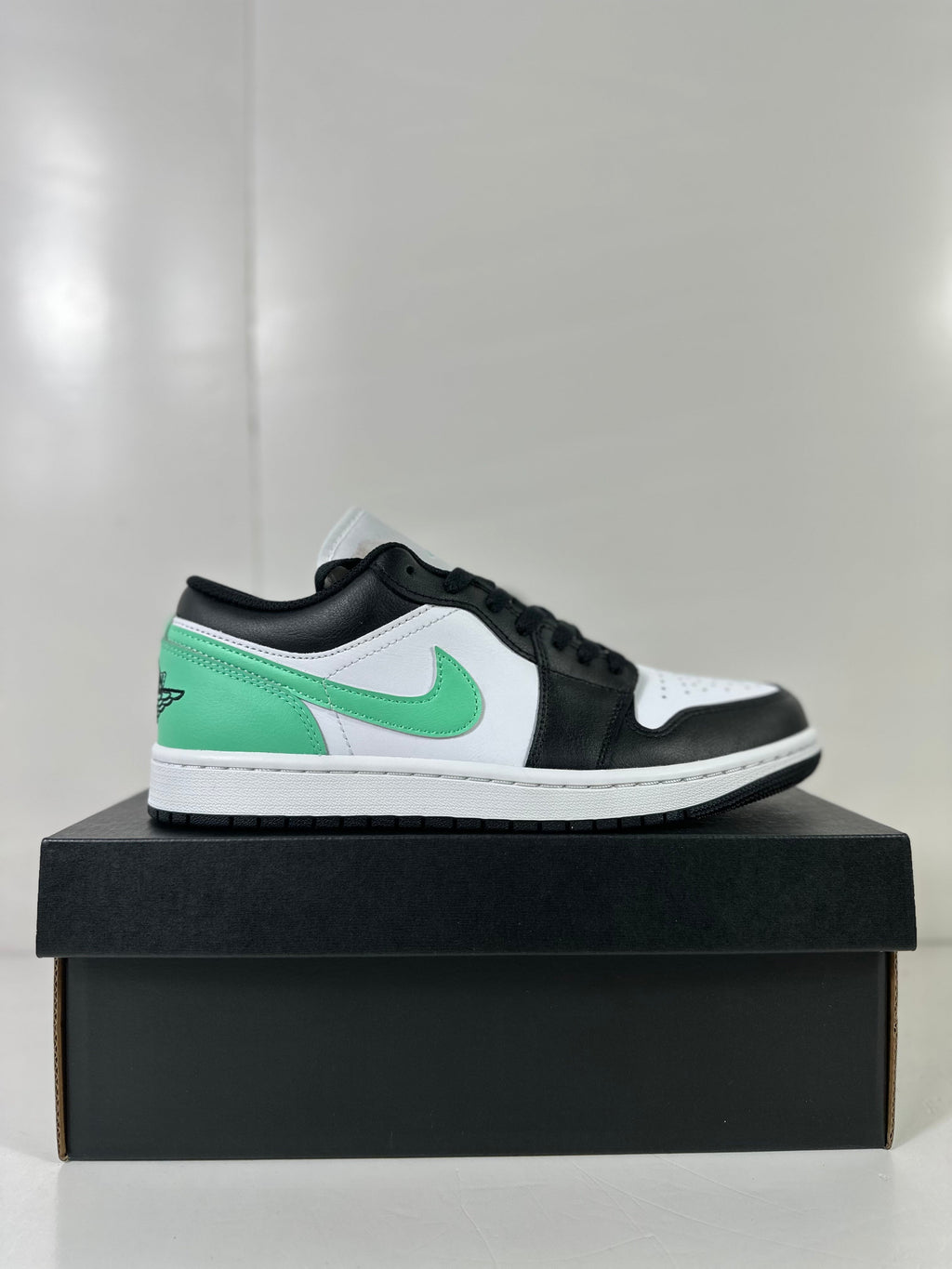 Air Jordan 1 Low White Green Black Sneakers 553558-131 - product image from the listing.