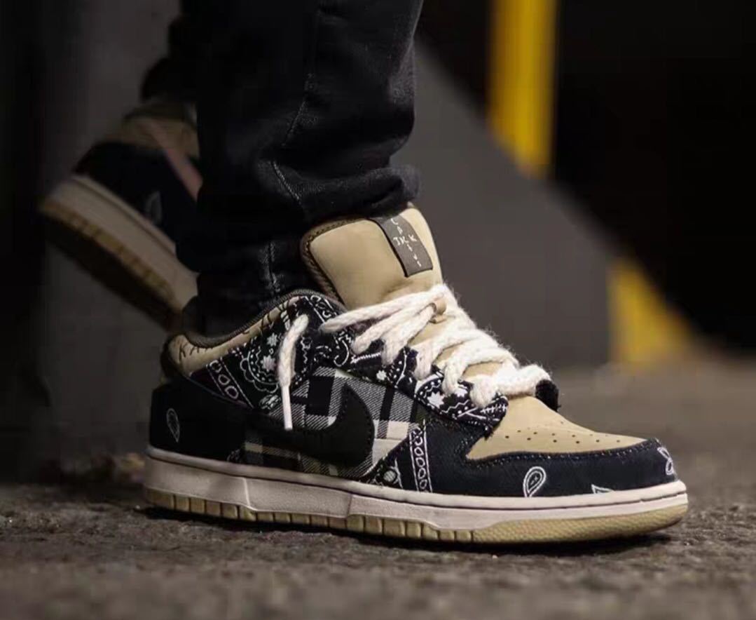 Black and Tan Jordan 1 High Paisley Pattern Sneakers - product image from the listing.