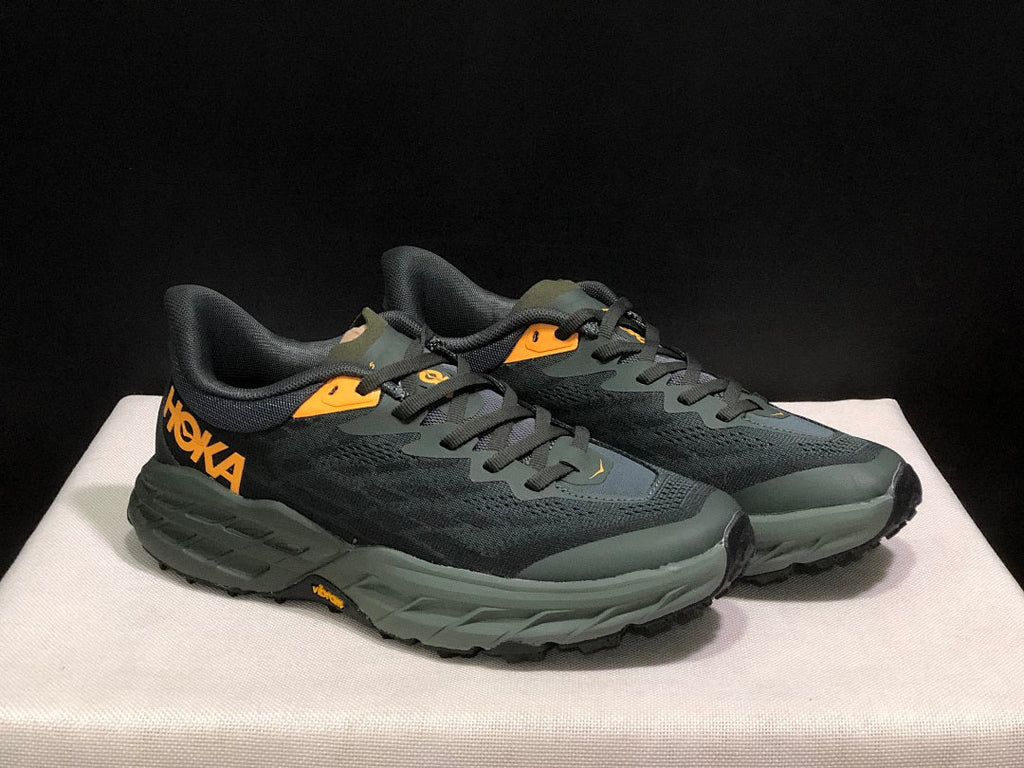 HOKA Speedgoat 5 Trail Running Shoes, in Black and Olive - product image from the listing.