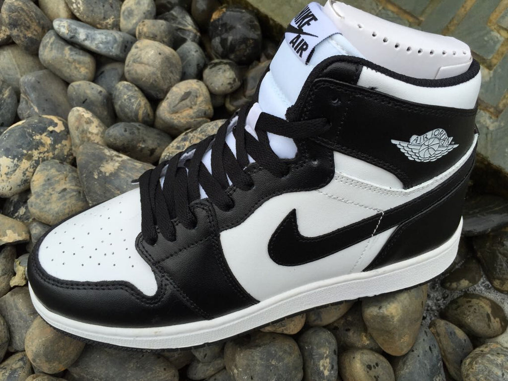 Women's Jordan 1 High Black and White Sneakers - product image from the listing.