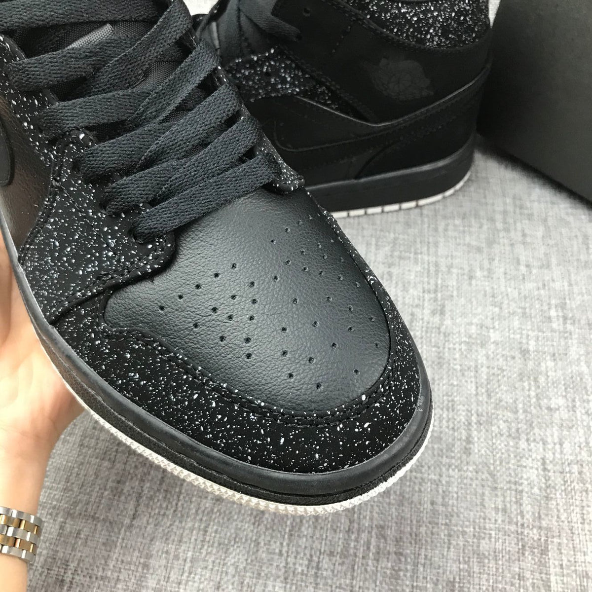 Air Jordan 1 Mid Black and White Sneakers 554724-001 - product image from the listing.