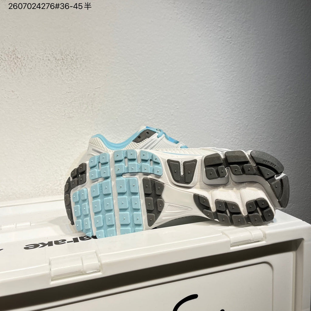 Nike Air Zoom Vomero 5 Sneakers in White and Blue - product image from the listing.