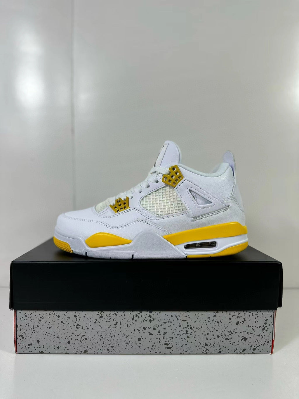 Air Jordan 4 White Yellow Sneakers AQ9129-102 - product image from the listing.