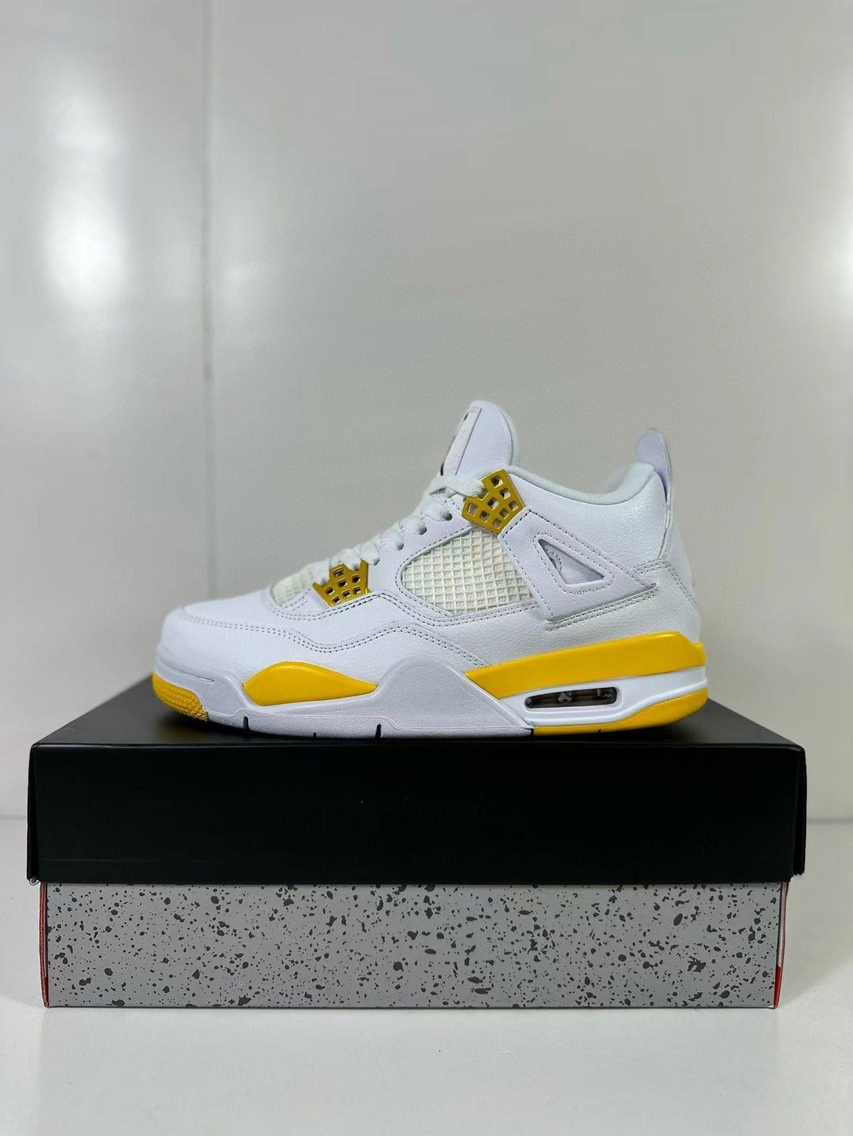Air Jordan 4 White Yellow Sneakers AQ9129-102 - product image from the listing.
