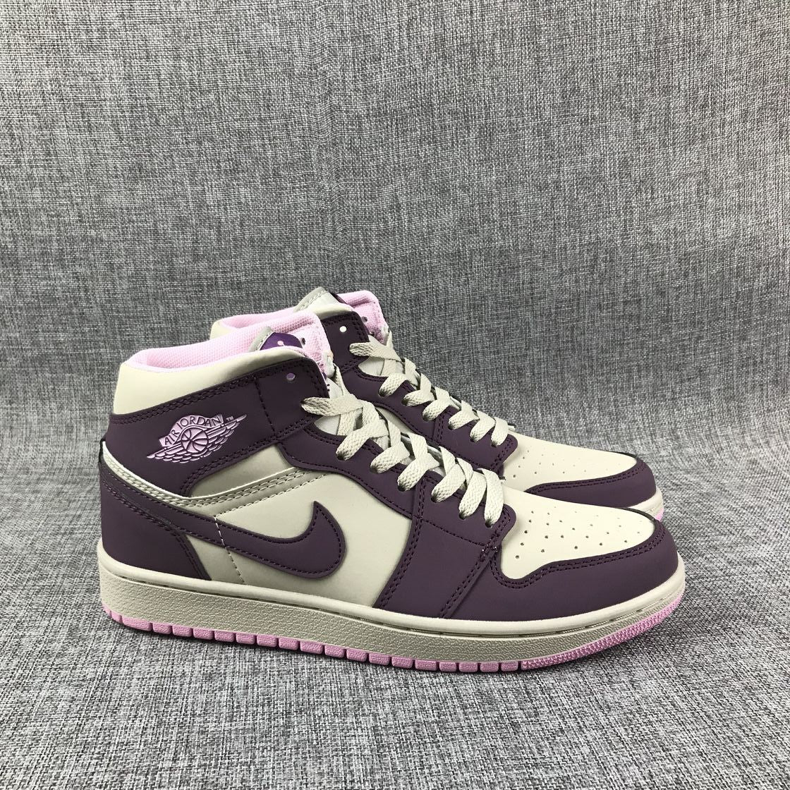 Air Jordan 1 Mid Sneakers in Pink Purple 555112-500 - product image from the listing.