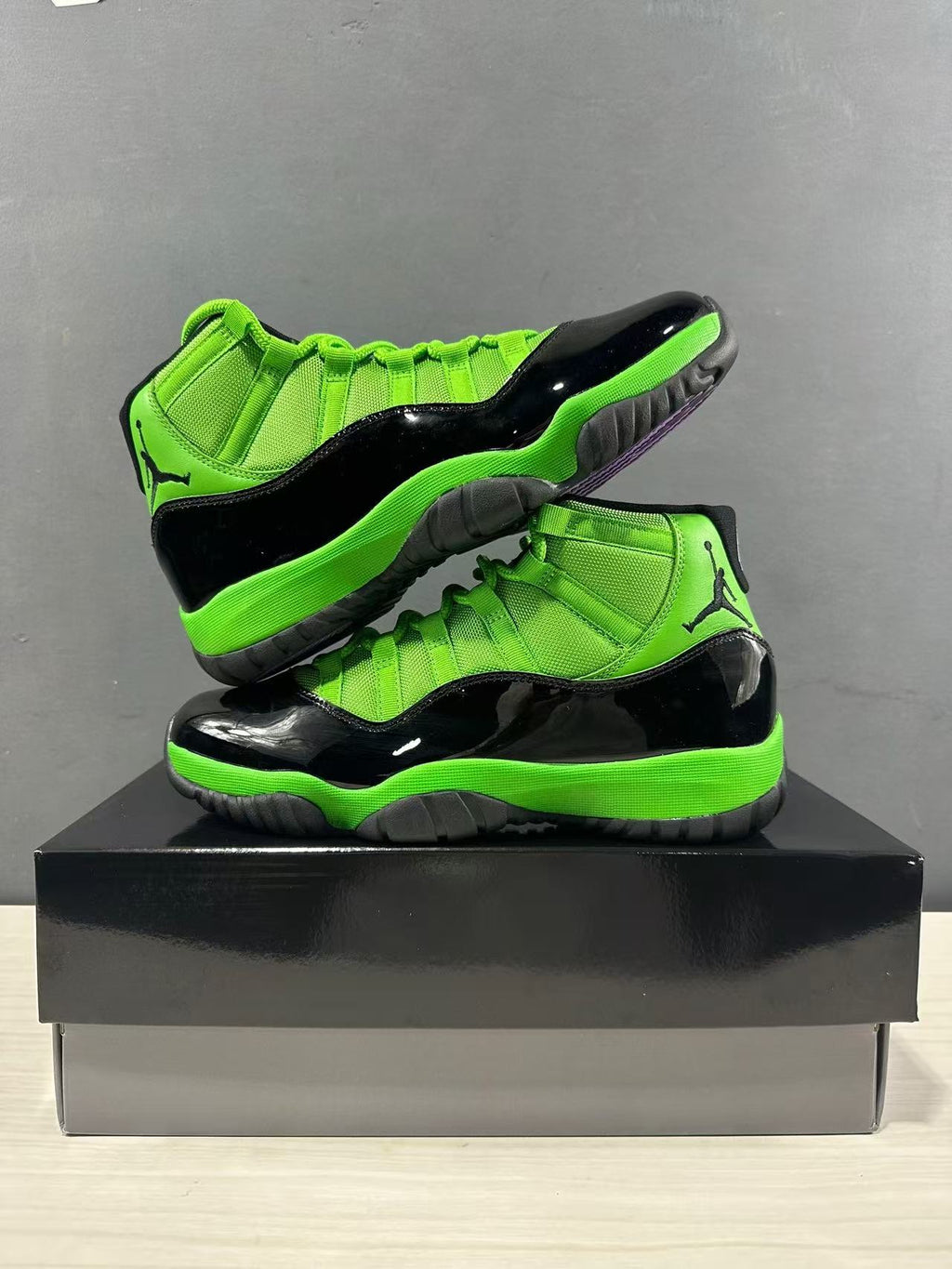 Air Jordan 11 Retro Sneakers in Black Green CT8012-310 - product image from the listing.