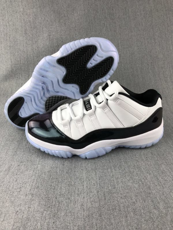White and Black Jordan 11 Low Sneakers - product image from the listing.