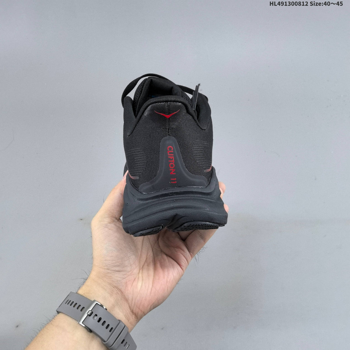 HOKA Clifton 11 Black Shoes for Running with Red Accents - product image from the listing.
