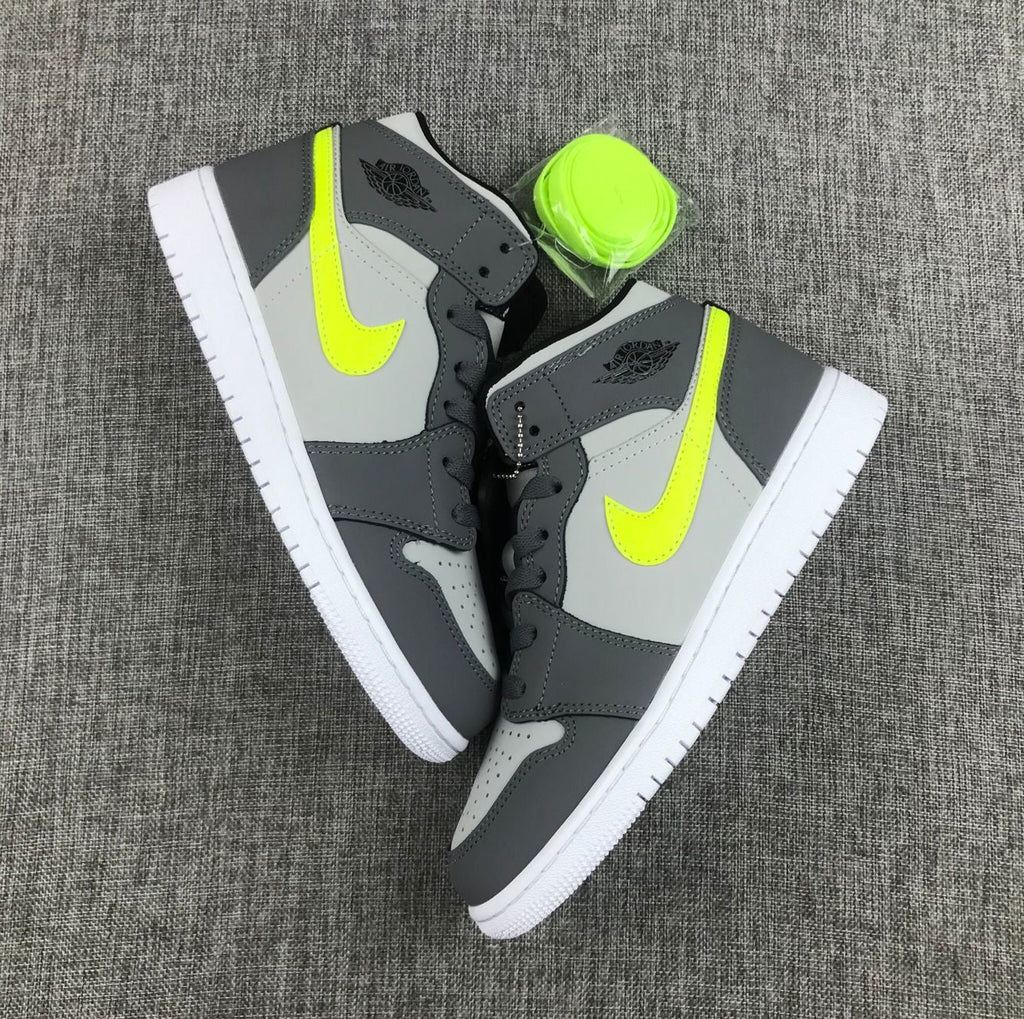 Air Jordan 1 Mid Sneakers in Grey Volt 554724-072 - product image from the listing.
