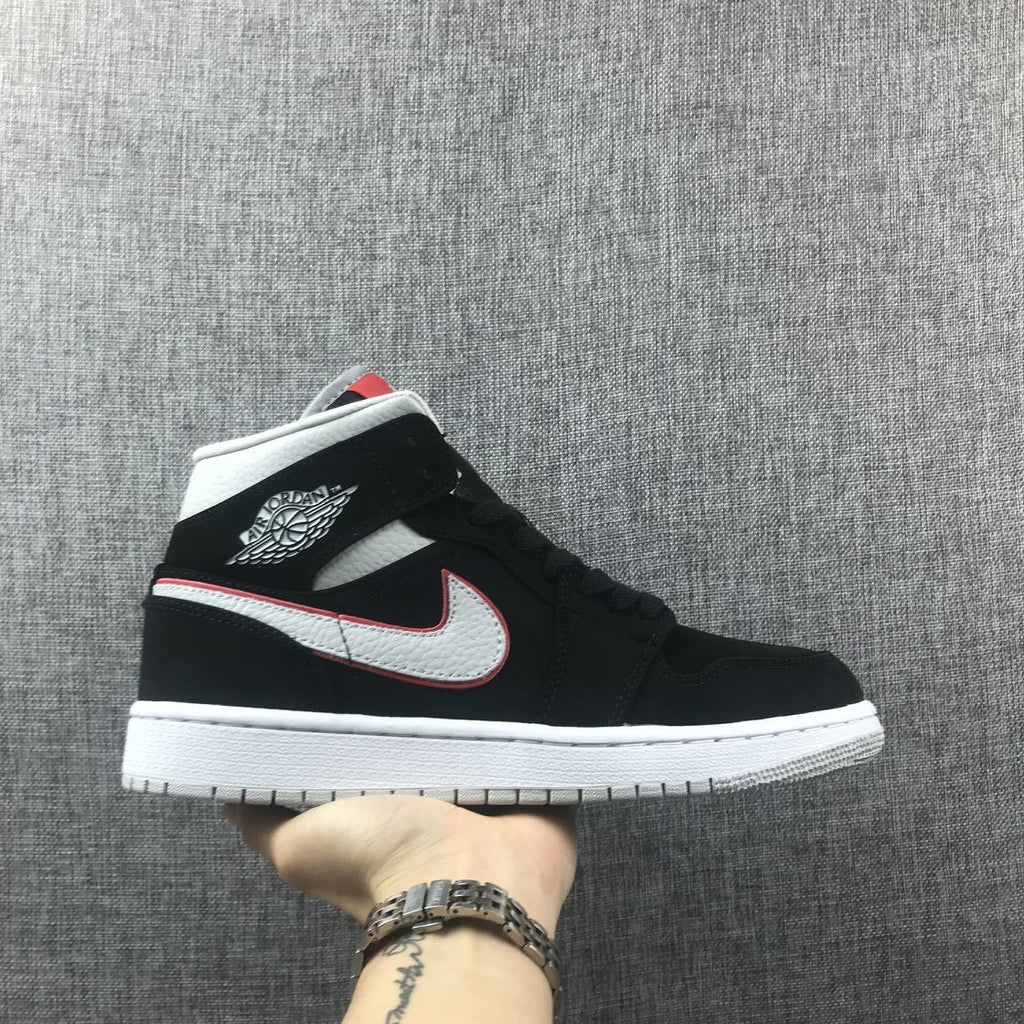 Air Jordan 1 Mid Black, Sneakers in White & Red 554724-060 - product image from the listing.