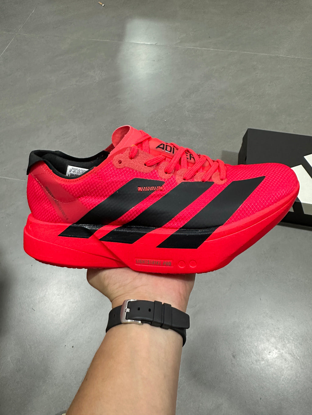 Nike Adizero Evo SL Running Shoes in Red Black JR6356 - product image from the listing.