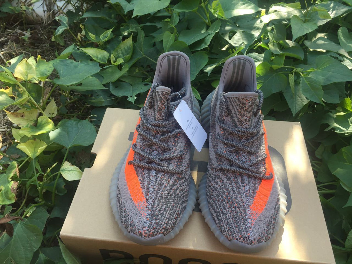 Yeezy 350 V2 Sneakers in Gray and Orange Knit - product image from the listing.