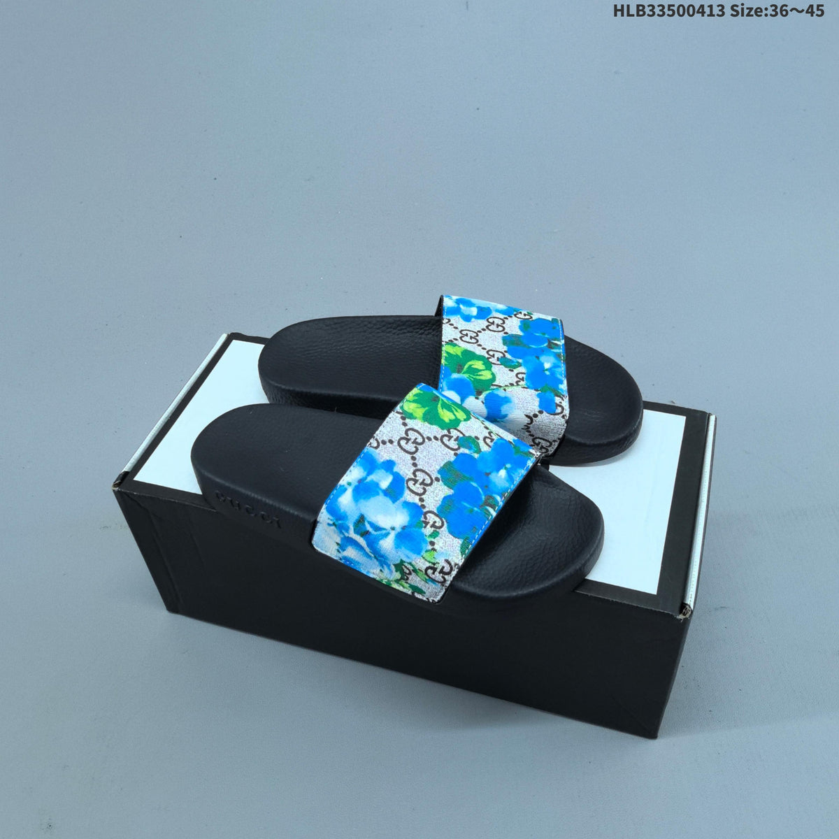 Floral Print Slide Sandals with Black Footbed by Gucci - product image from the listing.