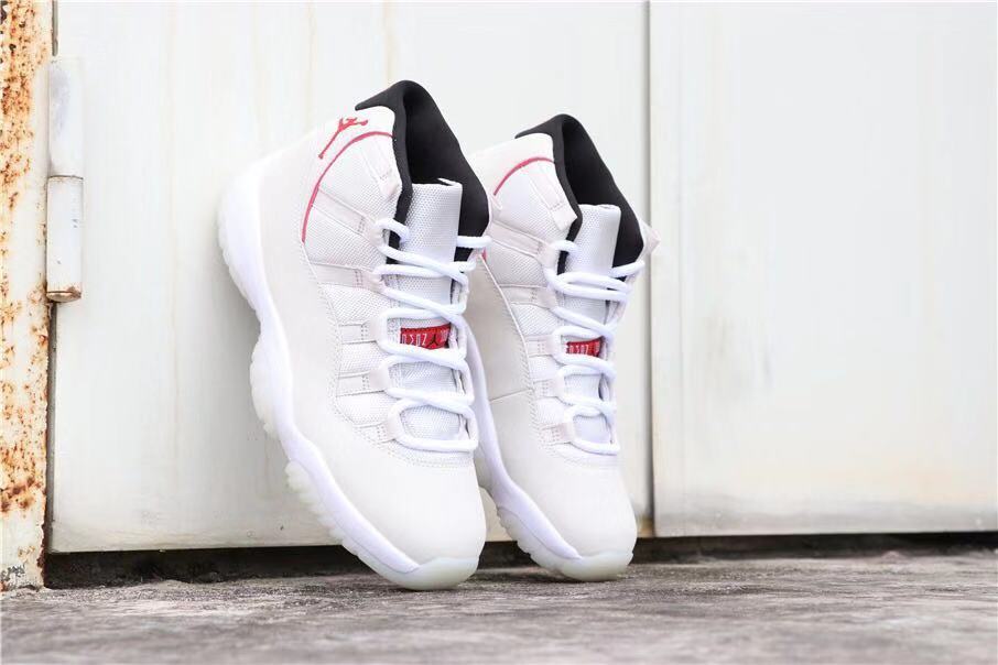 Air Jordan 11 Platinum Tint White High-Top Sneakers - product image from the listing.