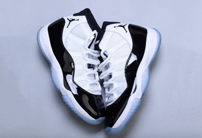 Air Jordan 11 Concord Black White Sneakers - product image from the listing.