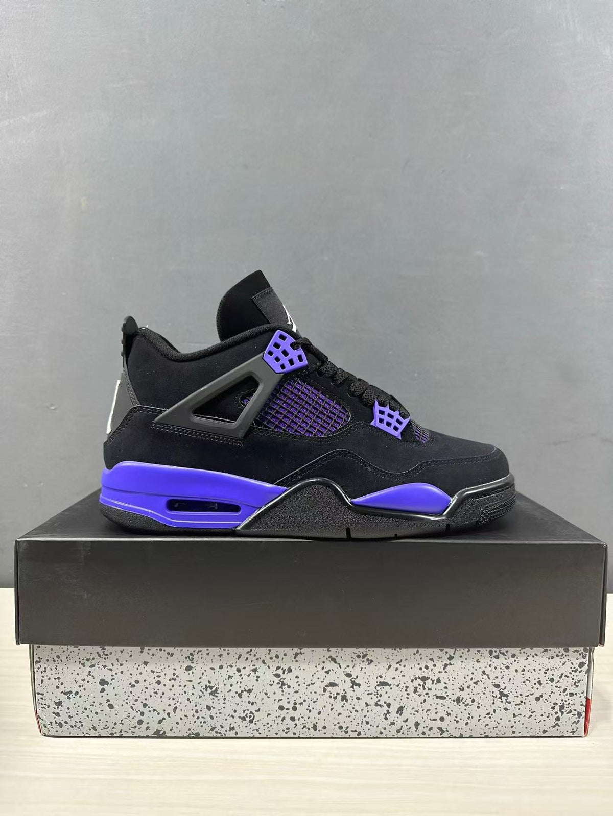 Air Jordan 4 Retro Black Blue Sneakers CT8527-018 - product image from the listing.