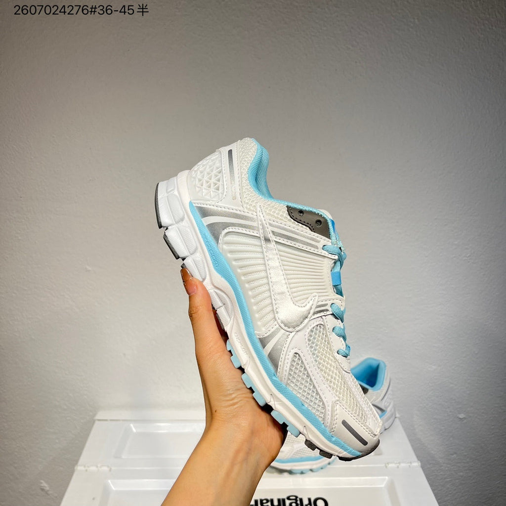 Nike Air Zoom Vomero 5 Sneakers in White and Blue - product image from the listing.