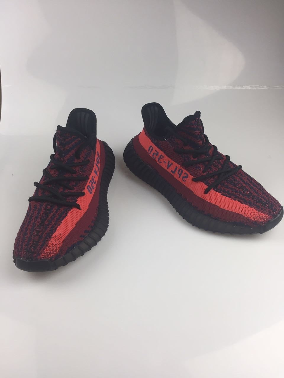 Adidas Yeezy Boost 350 V2 Sneakers in Black and Burgundy - product image from the listing.