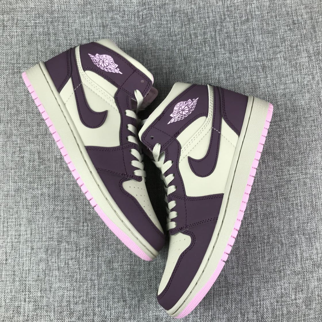 Air Jordan 1 Mid Sneakers in Pink Purple 555112-500 - product image from the listing.