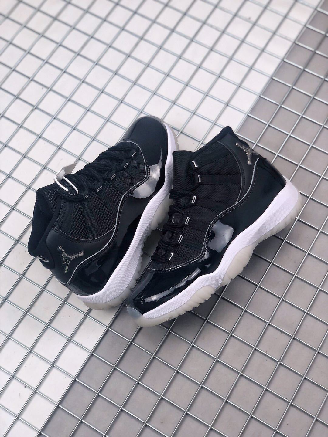 Air Jordan 11 Silver Eyelets Black White Sneakers - product image from the listing.
