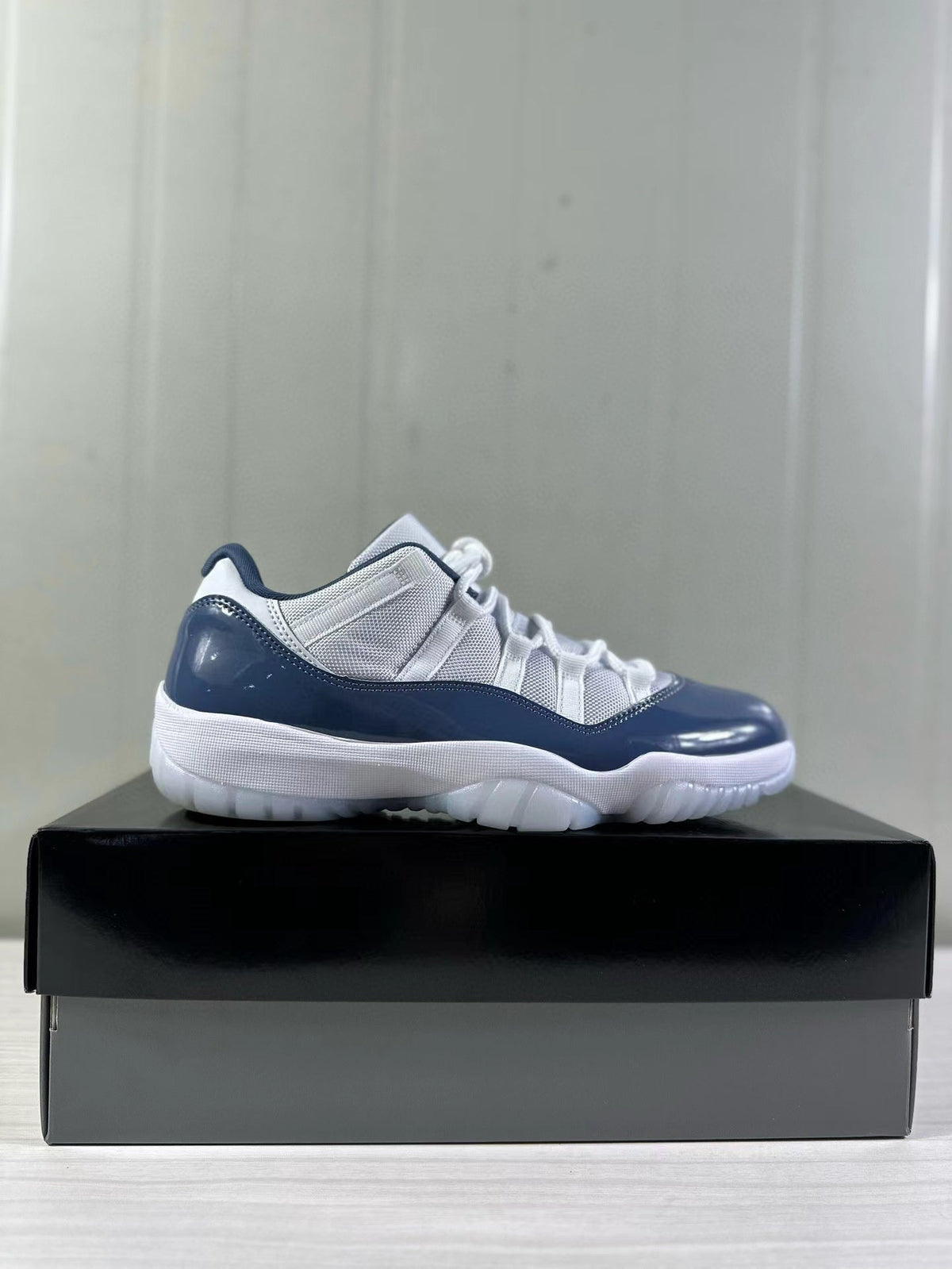 Air Jordan 11 Low Diffused Blue Sneakers FV5104-104 - product image from the listing.