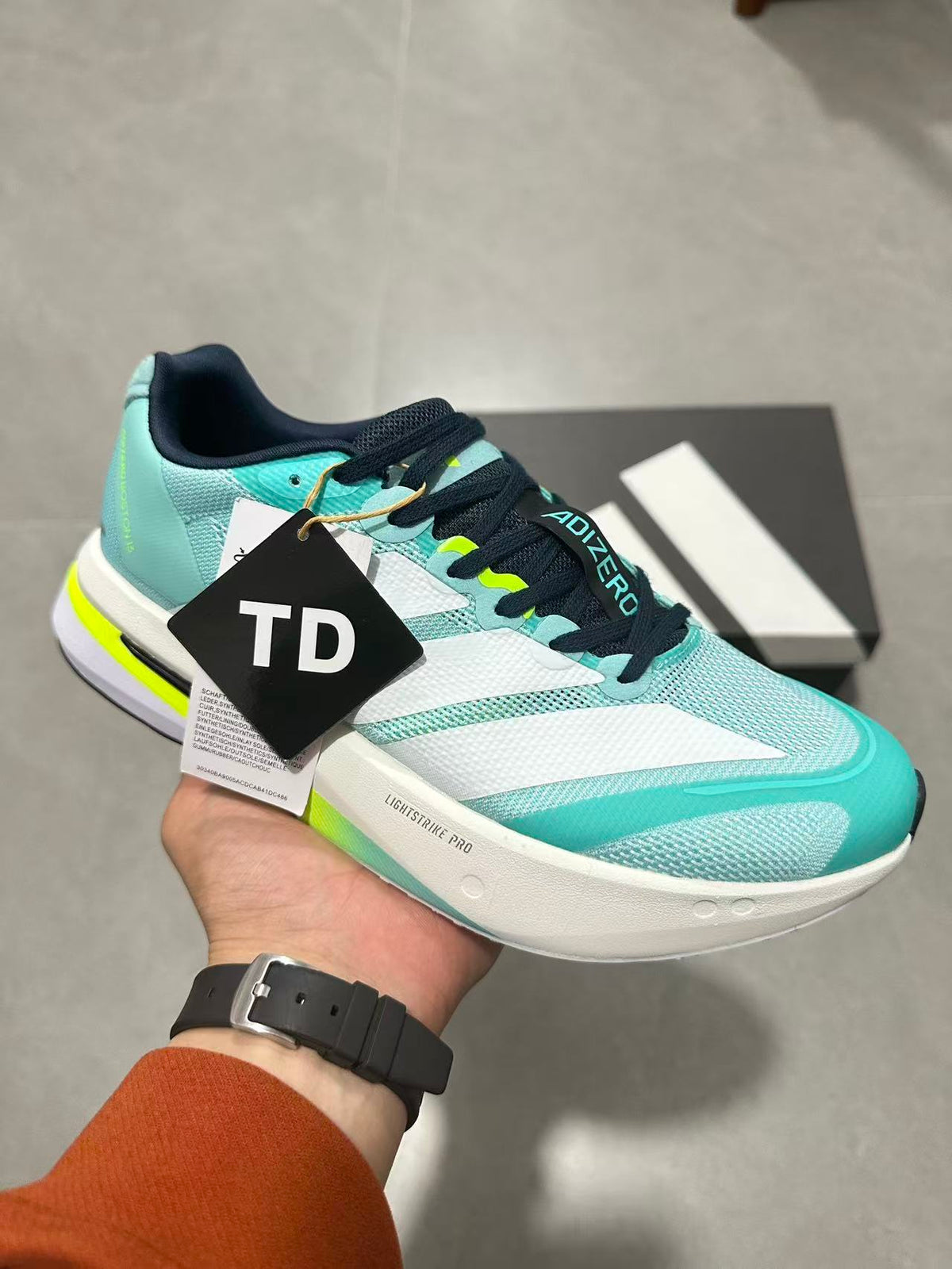 adidas Adizero Lightstrike Pro Running Shoes, in Mint and Black - product image from the listing.