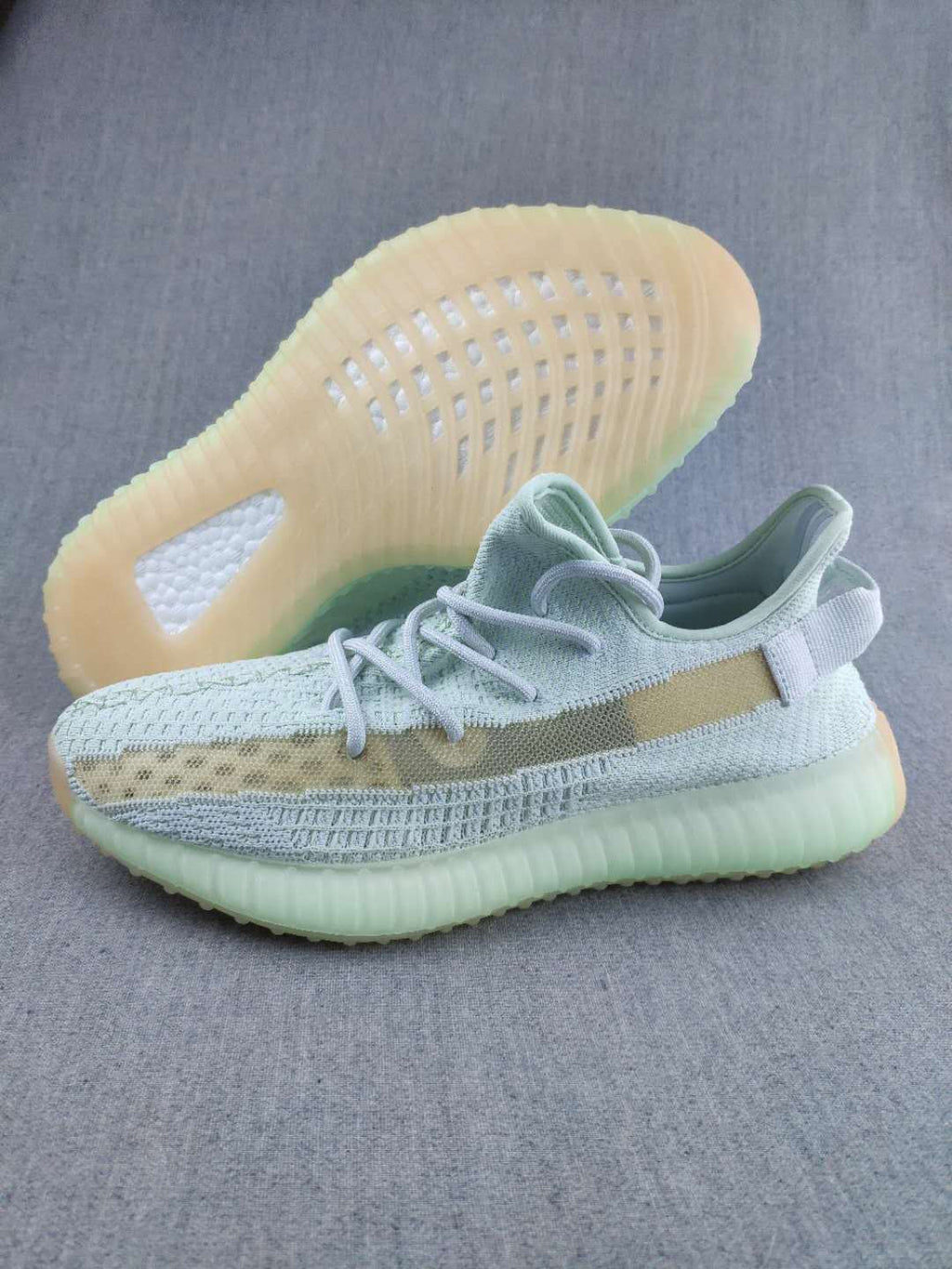 White and Tan Yeezy 350 V2 Knit Sneakers - product image from the listing.