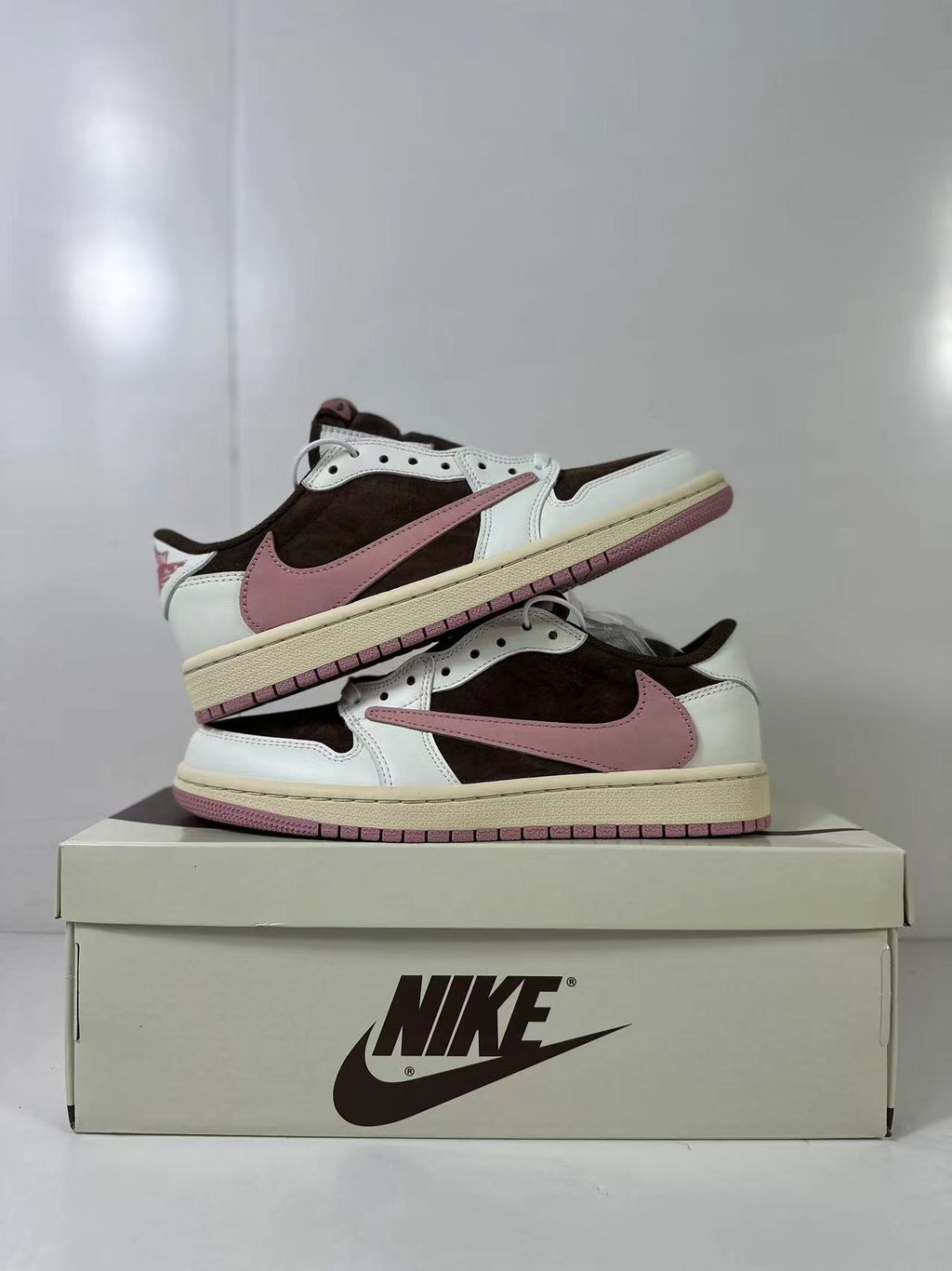 Jordan 1 Low Travis Scott in Brown White Pink DZ4137-206 - product image from the listing.