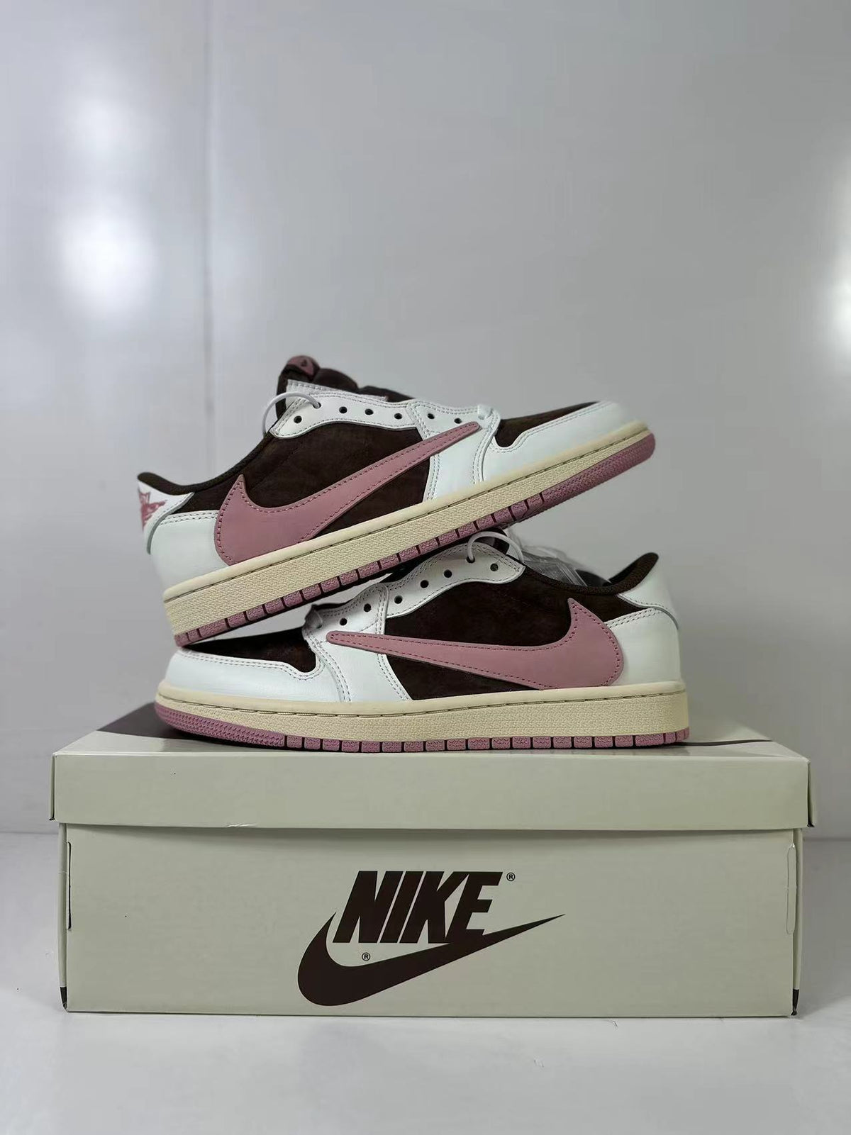 Jordan 1 Low Travis Scott in Brown White Pink DZ4137-206 - product image from the listing.